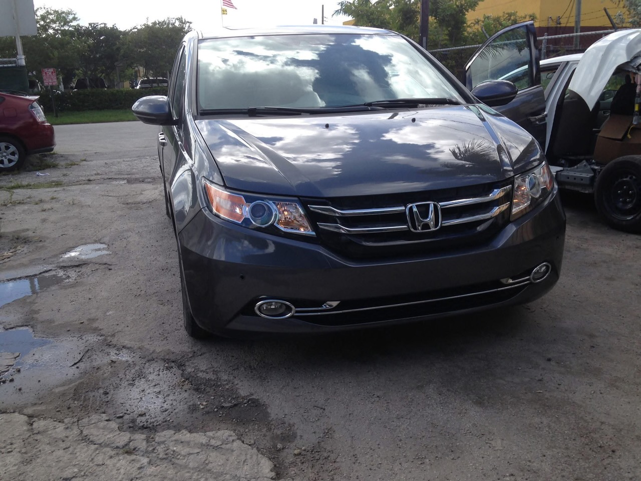 Front impact, grey Honda Odyssey — after repair